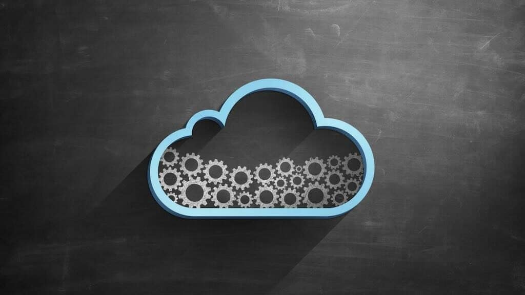 Automate your business - image of a cloud on a blackboard containing some gear cogs
