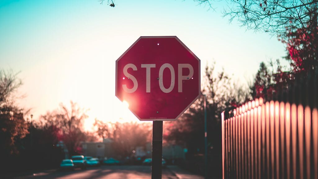 Image of a stop sign, accompanying some information about being aware to the threat of cyber fraud.