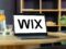 The Wix logo on a laptop computer.