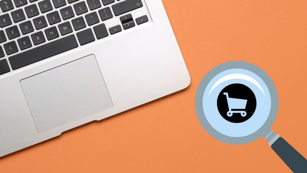 Ecommerce SEO tips (image of a laptop and a magnifying glass)
