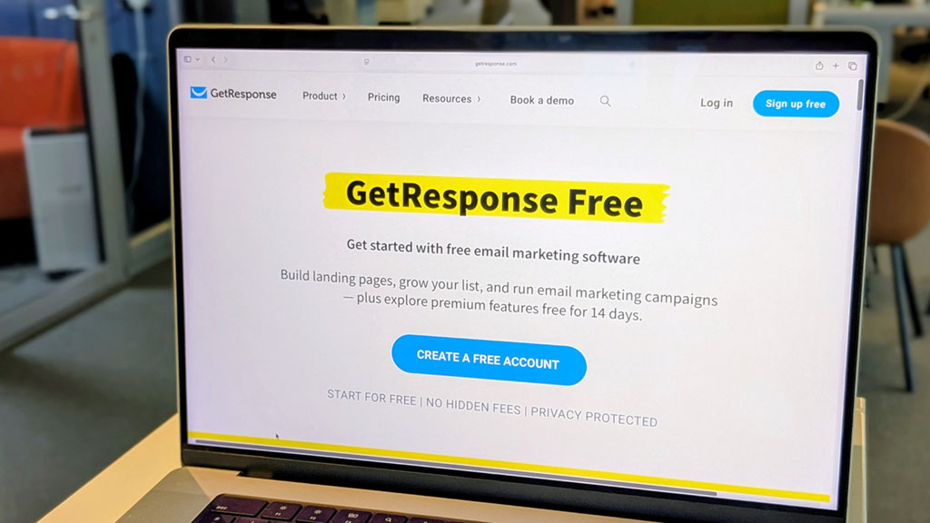 A photo of a laptop displaying the free plan page on the GetResponse website.